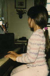 girl playing piano